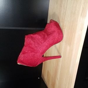 Red stiletto ankle boots.